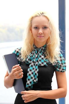 Portrait of the beautiful and young business woman