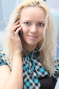 Portrait of the beautiful and young business woman