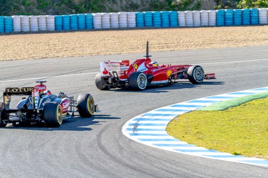 JEREZ DE LA FRONTERA, SPAIN - FEB 08: Pedro de la Rosa of Scuderia Ferrari F1 followed by Kimi Raikkonen of Lotus races on training session on February 08 , 2013, in Jerez de la Frontera , Spain