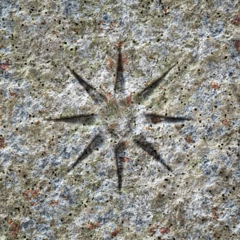 An image of a stone texture with a star