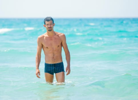 Happy Swimming. Cute adult men in the water.