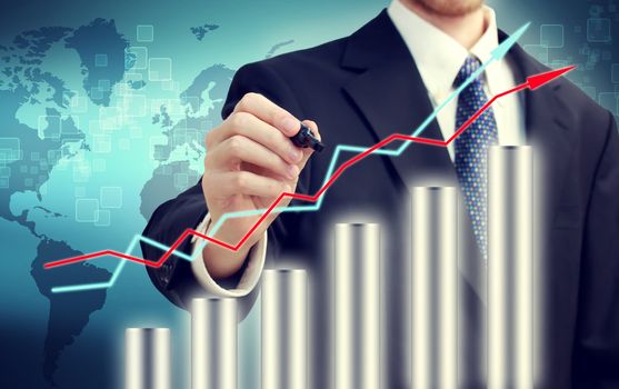 Businessman with graph representing growth