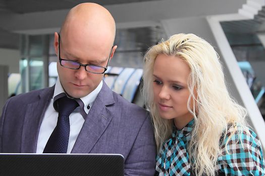Business man and the woman discuss the project