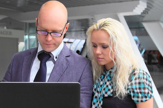 Business man and the woman discuss the project
