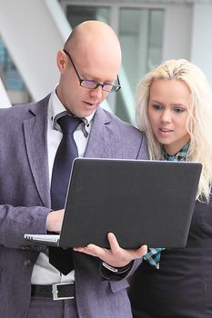 Business man and the woman discuss the project