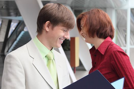 Business man and the woman discuss the project