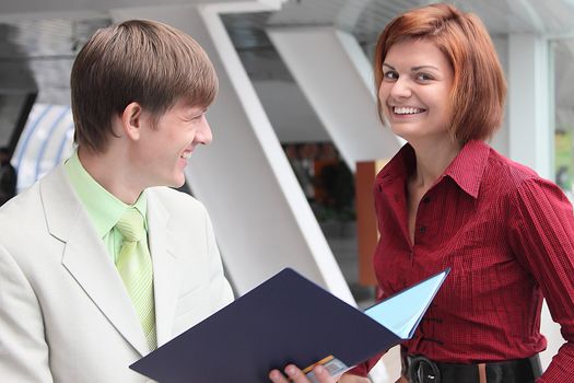 Business man and the woman discuss the project