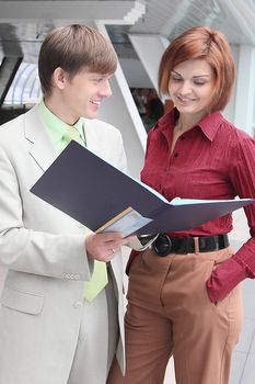Business man and the woman discuss the project