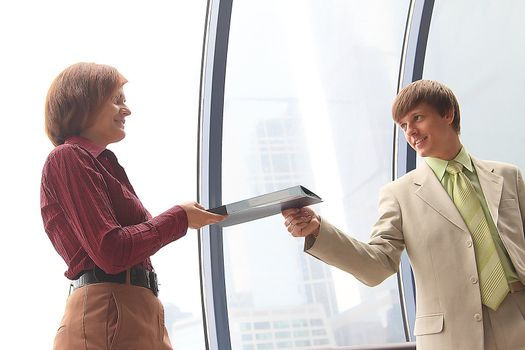Business man and the woman discuss the project