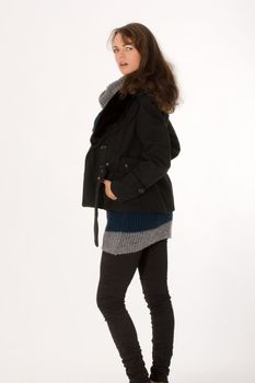 Laughing Model posing in winter clothes in the studio