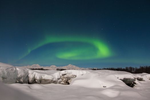 Northern lights circle over North American's highest mountain.