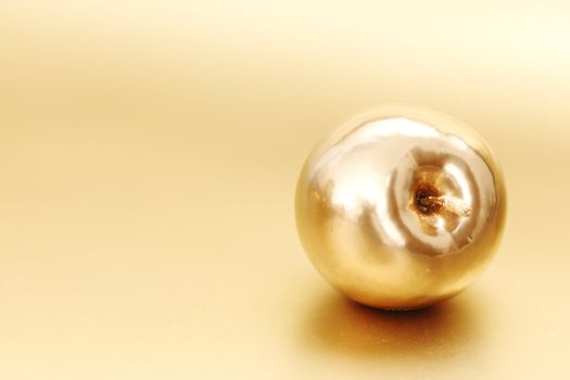  gold apple on gold background