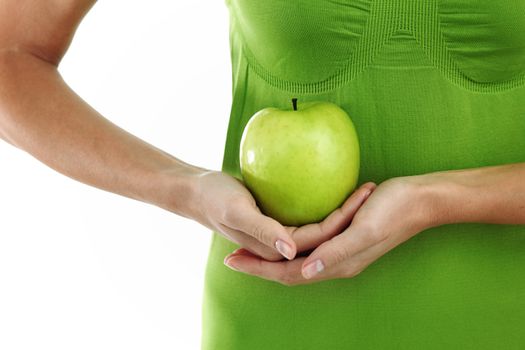 green apple in woman hands