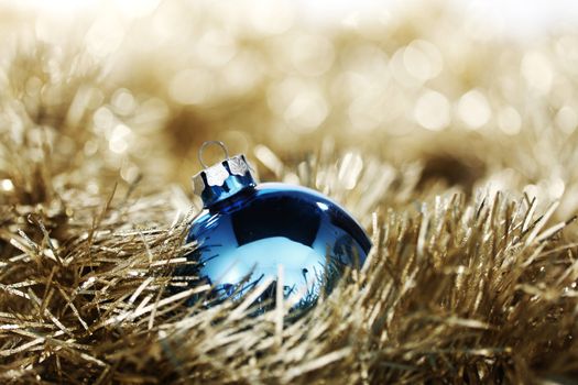  blue christmas ball on golden background