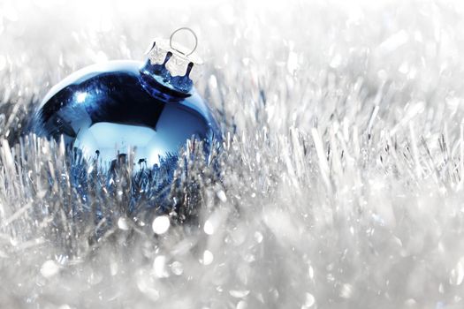 blue christmas ball on silver background