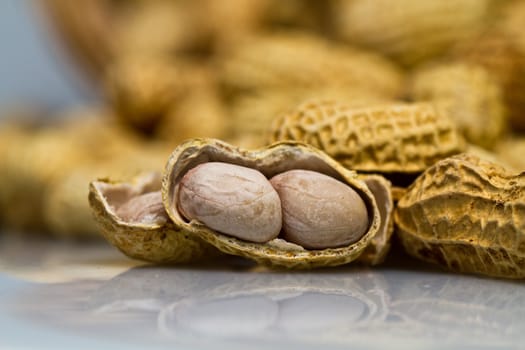 Close up view of an opened groundnut in landscape orientation as abstract background