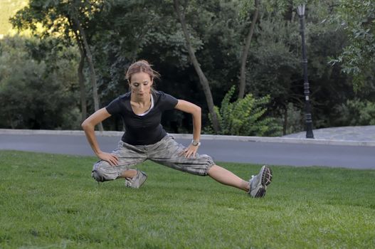 Trainer stretching in forest