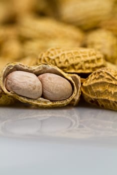 Close up view of an opened groundnut in portrait orientation as background