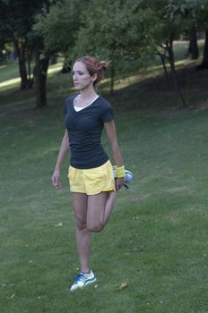 Trainer stretching in forest