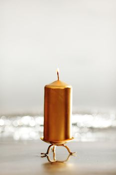  christmas candle close up on bokeh background