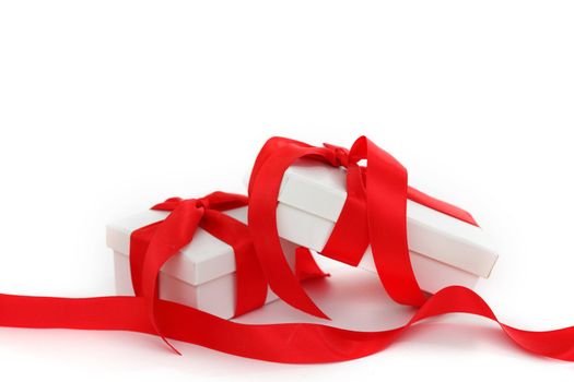 white gift with red ribbon