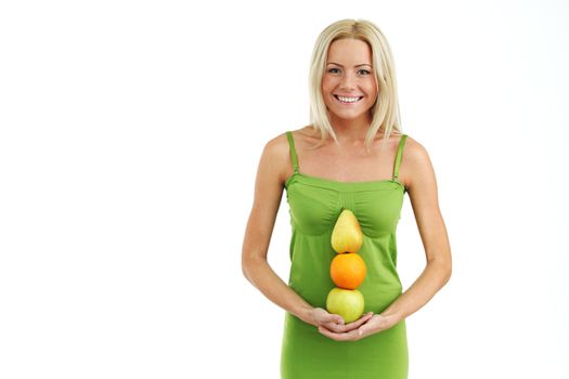 fruit pile in woman hands on white