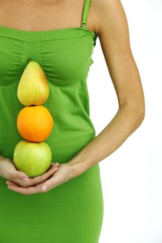 fruit pile in woman hands on white