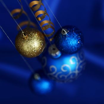 christmas balls on blue satin background