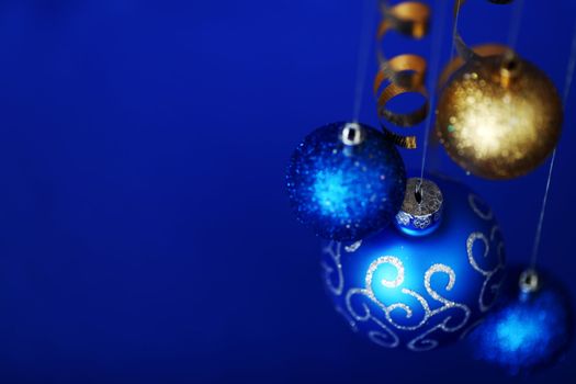 christmas balls on blue satin background