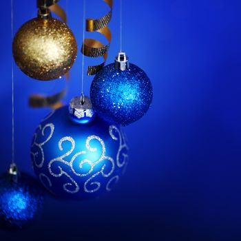 christmas balls on blue satin background