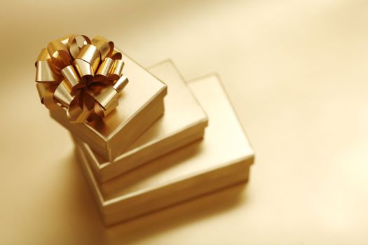 golden christmas gifts on gold background 