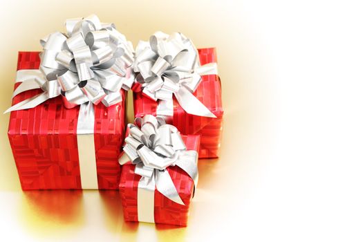 golden christmas gifts on gold background 