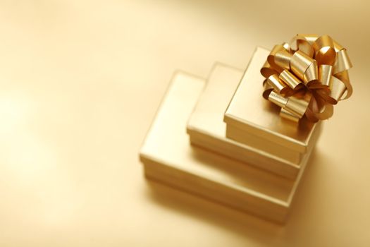 golden christmas gifts on gold background 