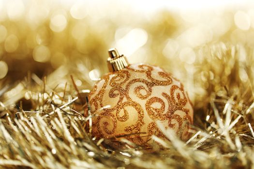 golden christmas ball on christmas background