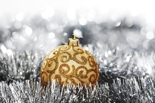  golden christmas ball on silver background