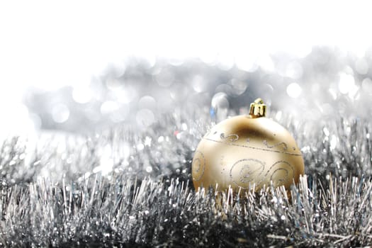  golden christmas ball on silver background