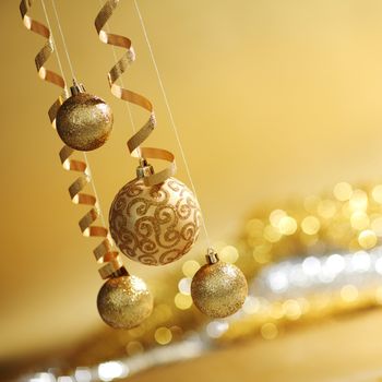 golden christmas balls on bokeh background