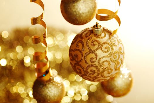 golden christmas balls on bokeh background