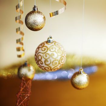 golden christmas balls on bokeh background