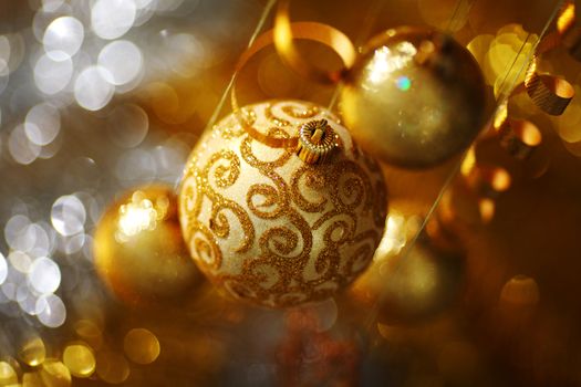 golden christmas balls on bokeh background