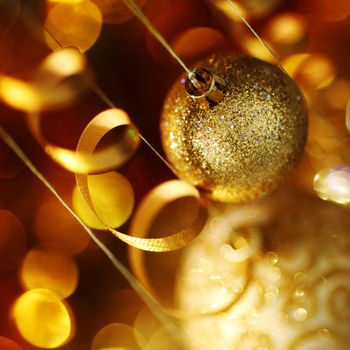golden christmas balls on bokeh background