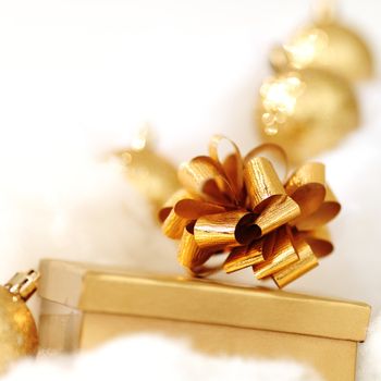 golden gifts on white close up