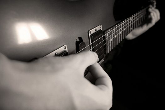 hand playing guitar