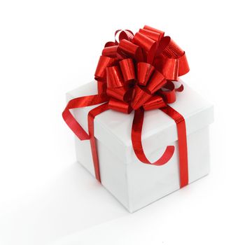 white christmas gift with red ribbon