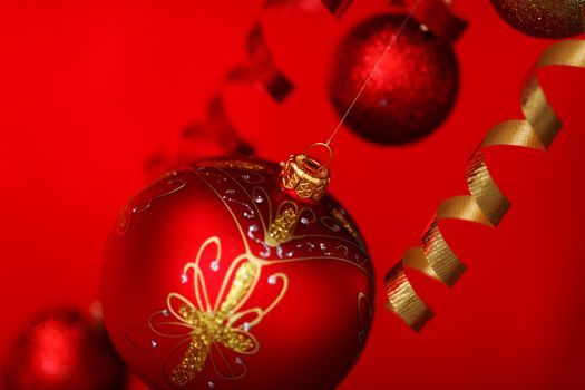  christmas balls on red satin background