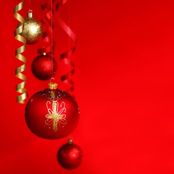  christmas balls on red satin background