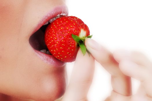 woman eat strawberry macro close up