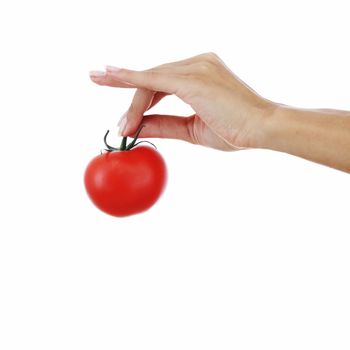 isolated tomato in woman hands close up