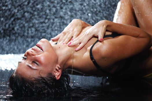 sexy woman in water studio