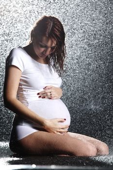 pregnant woman in water studio